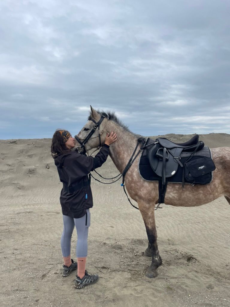 Alice with her horse on the dunes